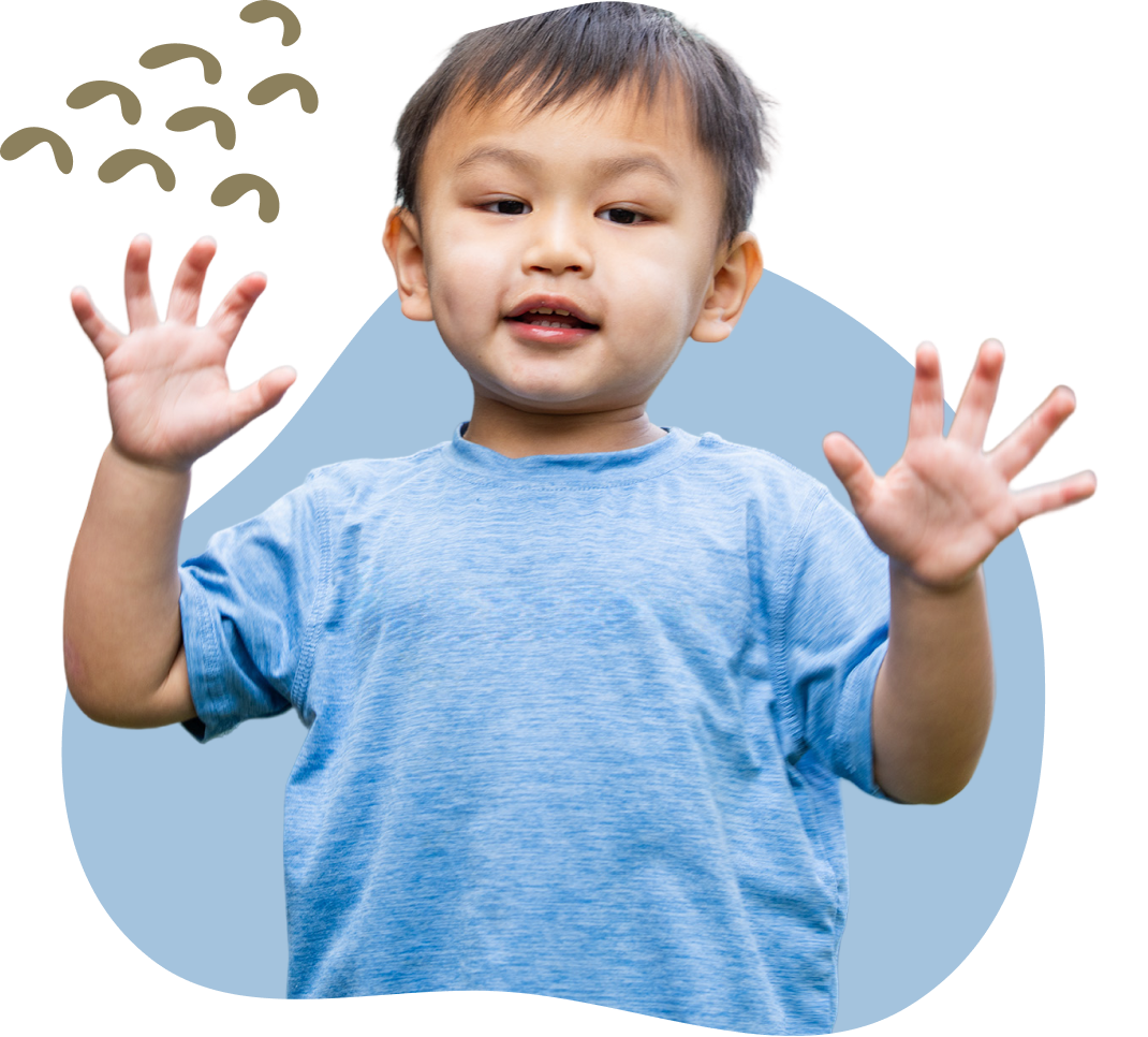 child in blue shirt smiling 