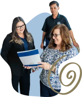 three people looking at a document