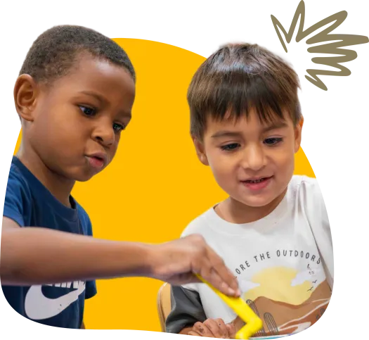 two boys playing and smiling