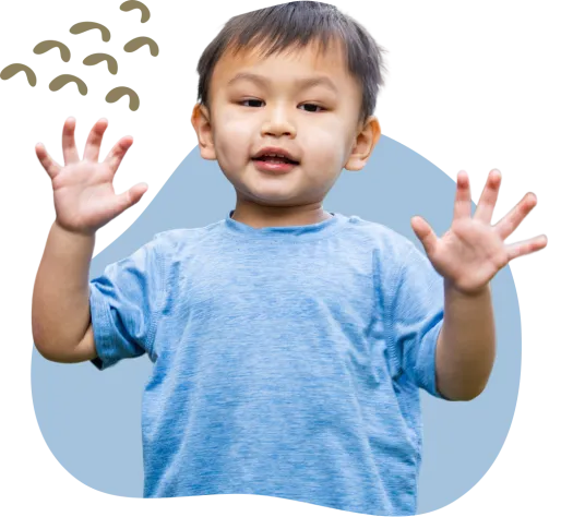 child in blue shirt smiling 