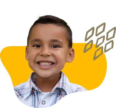 boy with short hair smiling while wearing white button up shirt